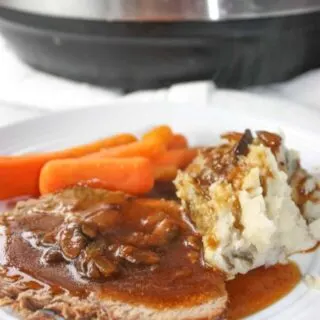 Sunday dinner is served in a fraction of the time!  Instant Pot Sirloin Tip Roast is so tender and served up with sides of baby carrots and potatoes.  Finish it off by covering it in a gluten free mushroom gravy.
