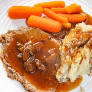 Sunday dinner is served in a fraction of the time!  Instant Pot Sirloin Tip Roast is so tender and served up with sides of baby carrots and potatoes.  Finish it off by covering it in a gluten free mushroom gravy.