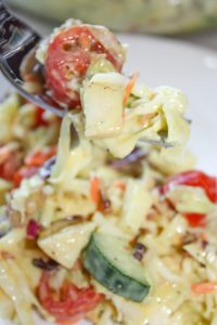 Loaded Coleslaw is a refreshing side dish in the warmer weather.  This colourful salad is loaded with bacon, tomatoes, cucumbers, Asian pears and then smothered in a slightly sweet yet tangy dressing.