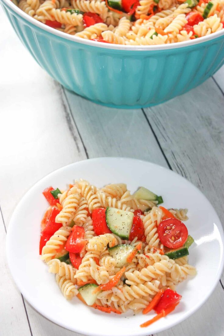 Easy Pasta Salad is a tasty cold side dish recipe loaded with chopped vegetables and tossed in Zesty Italian dressing. This gluten free pasta salad is a quick and easy recipe that even those that can consume gluten will enjoy!