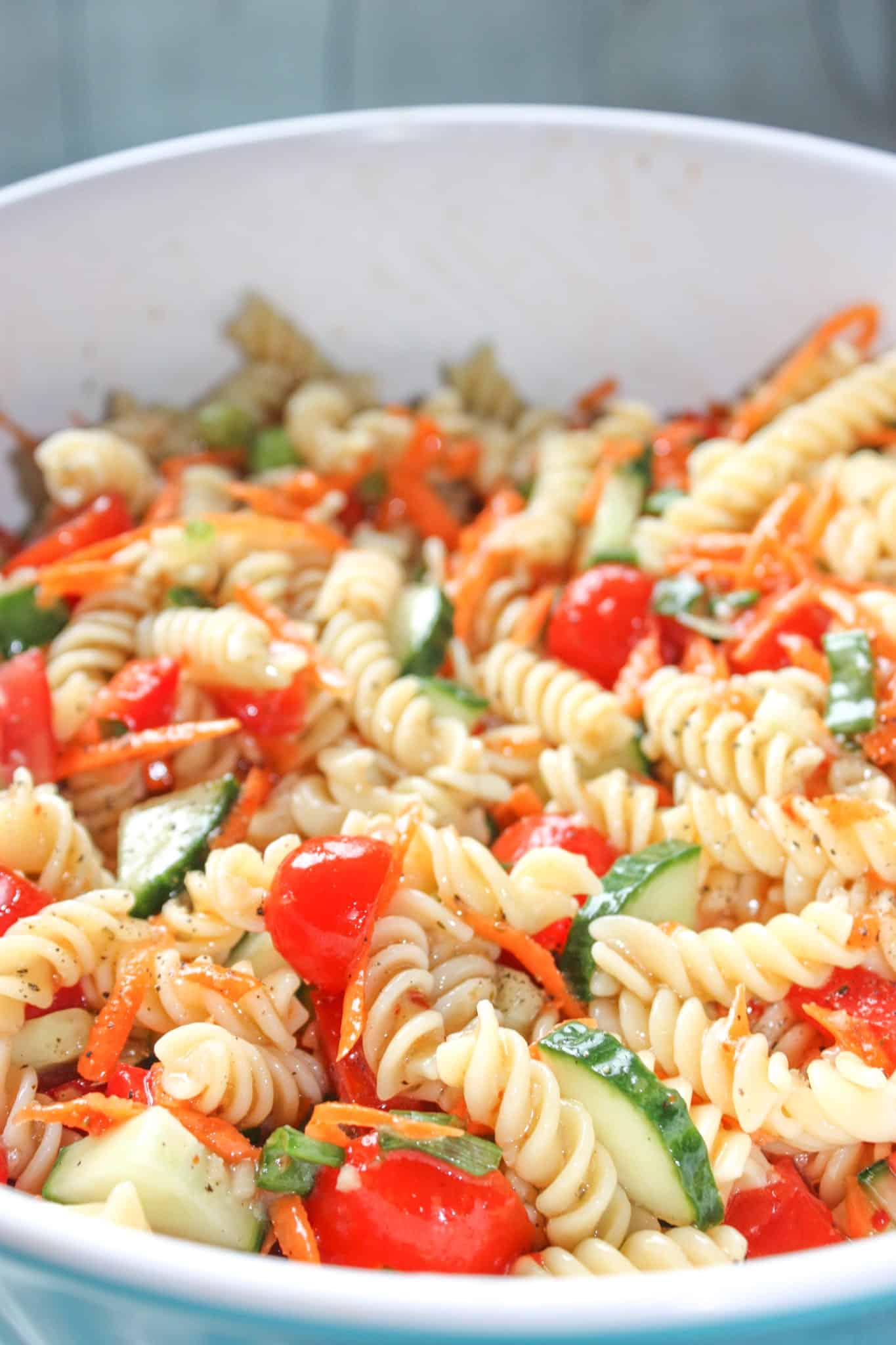 Easy Pasta Salad is a tasty cold side dish recipe loaded with chopped vegetables and tossed in Zesty Italian dressing. This gluten free pasta salad is a quick and easy recipe that even those that can consume gluten will enjoy!