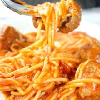Instant Pot Spaghetti and Meatballs is an easy and delicious pressure cooker pasta recipe.  This family dinner recipe uses gluten free pasta and is loaded with gluten free meatballs and Tomato Basil pasta sauce.