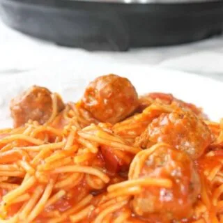 Instant Pot Spaghetti and Meatballs is an easy and delicious pressure cooker pasta recipe.  This family dinner recipe uses gluten free pasta and is loaded with gluten free meatballs and Tomato Basil pasta sauce.