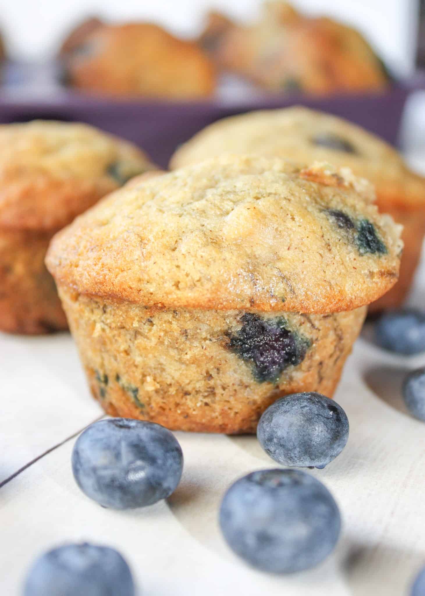 Blueberry Banana Muffins are a tasty seasonal twist on traditional banana muffins.  This moist and delicious gluten free snack is loaded with fresh blueberries.