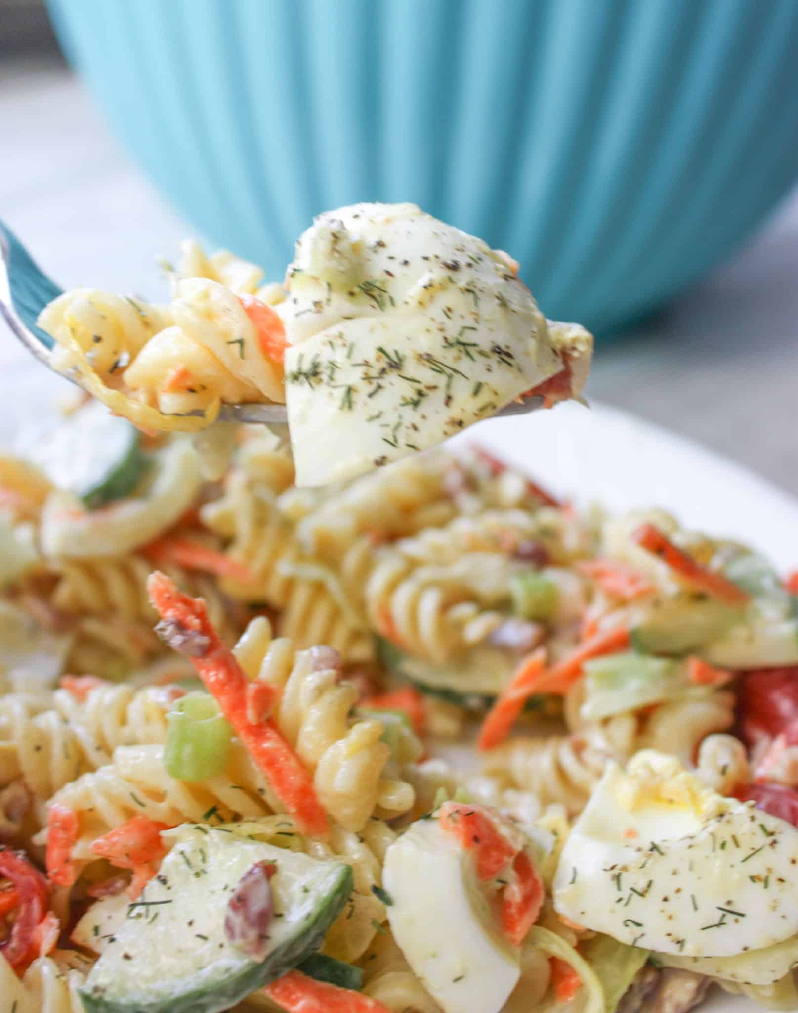Creamy Dill Pasta Salad is a flavourful side dish for any occasion.  Loaded with gluten free pasta, vegetables, bacon and dried dill it is a tasty,colourful addition to any meal.