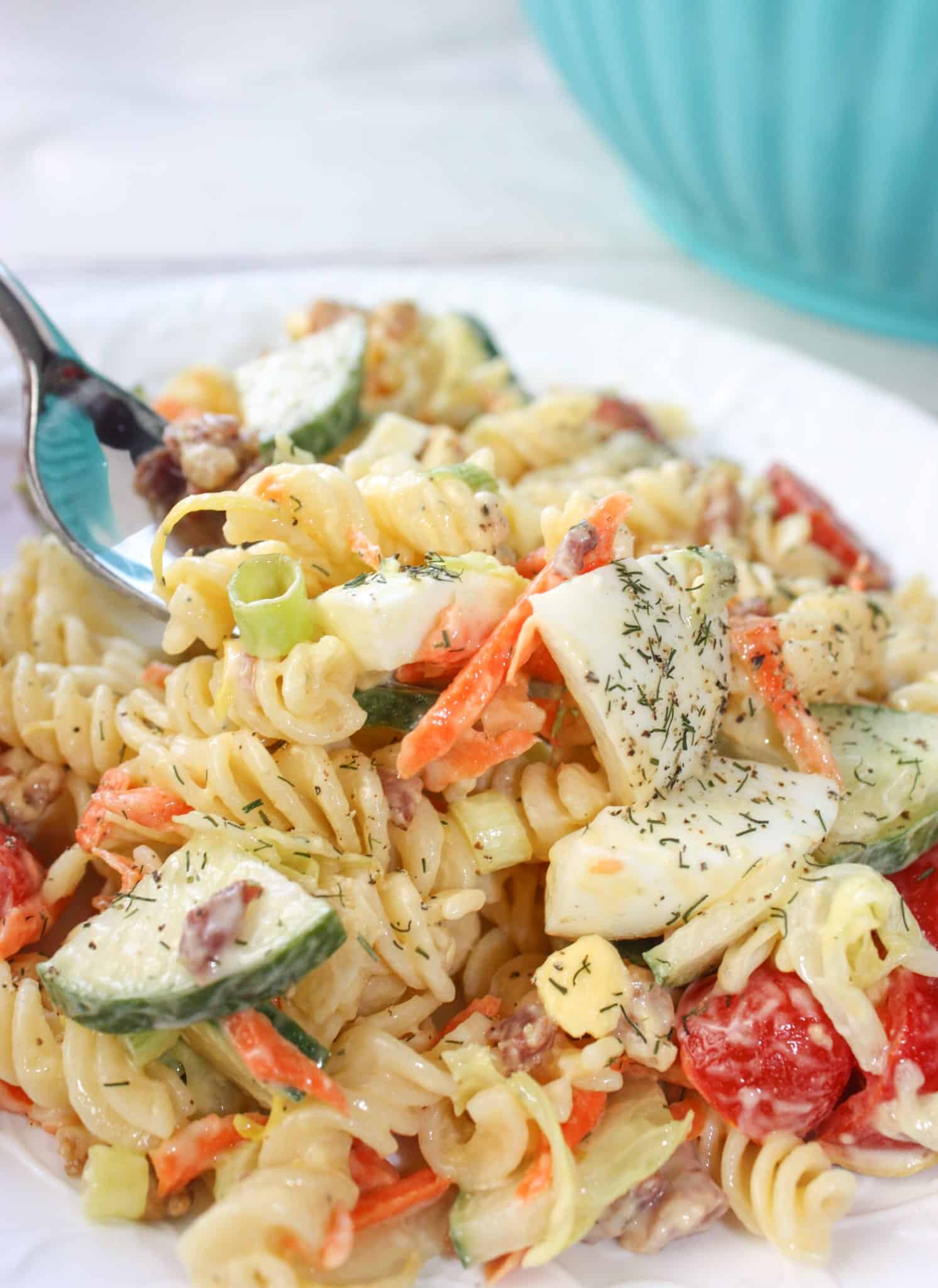 Creamy Lemon Dill Pasta Salad is a flavourful side dish for any occasion.  Loaded with gluten free pasta, vegetables, bacon and dried dill it is a tasty,colourful addition to any meal.