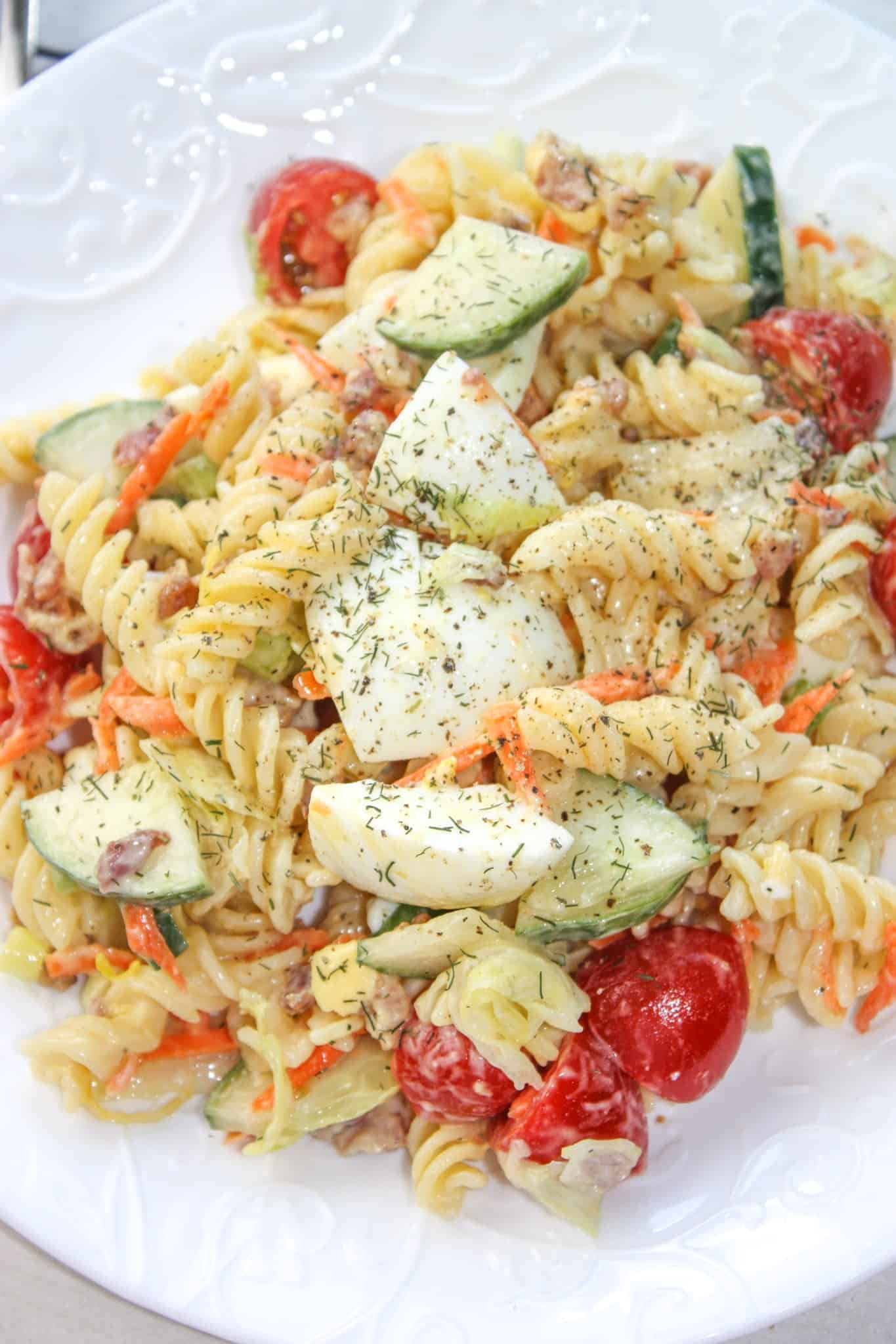 Creamy Lemon Dill Pasta Salad is a flavourful side dish for any occasion.  Loaded with gluten free pasta, vegetables, bacon and dried dill it is a tasty,colourful addition to any meal.