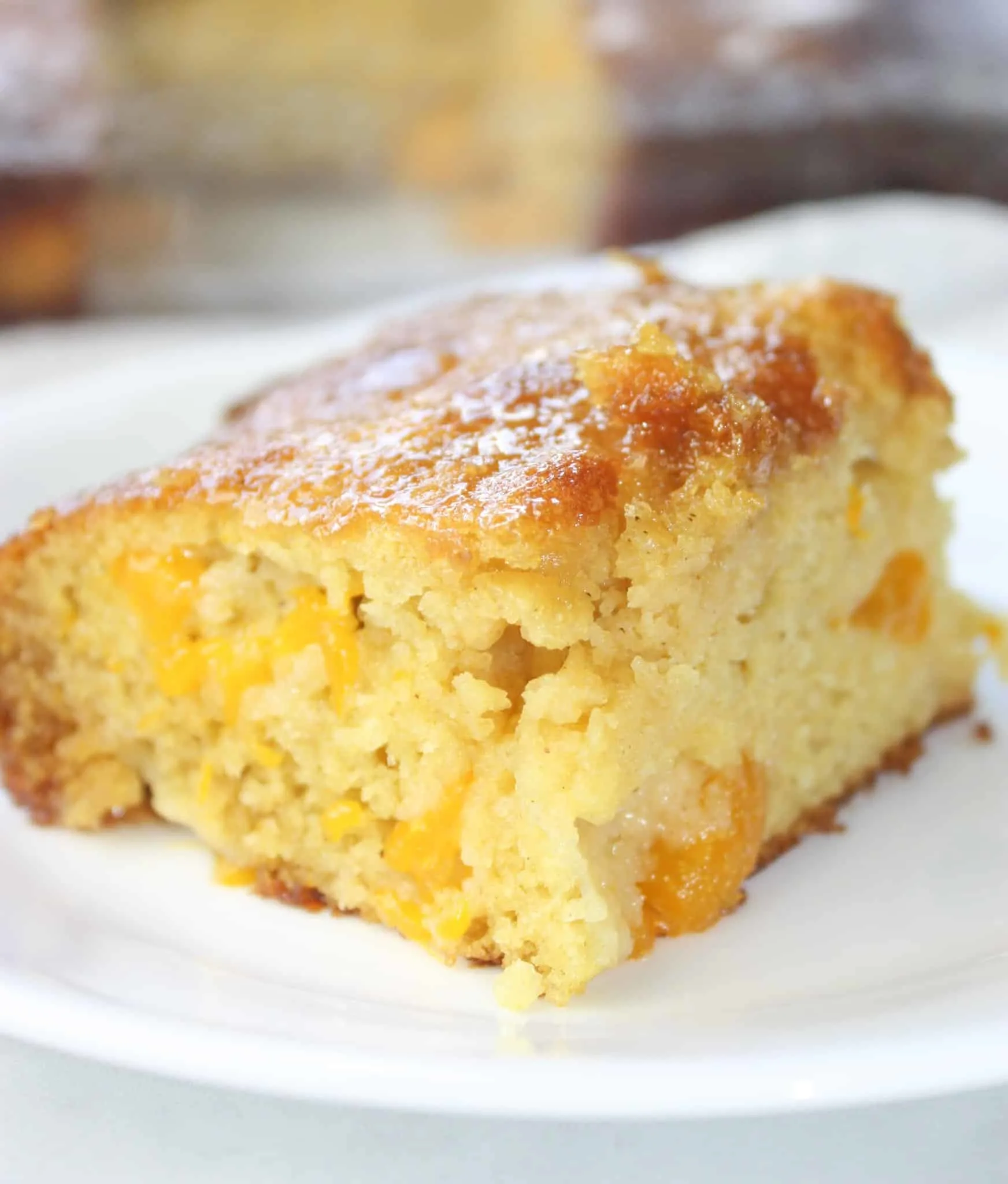 Gluten Free Mandarin Cake is a very quick and easy recipe to make. Loaded with mandarin oranges it is a nice burst of citrus any time of the year.
