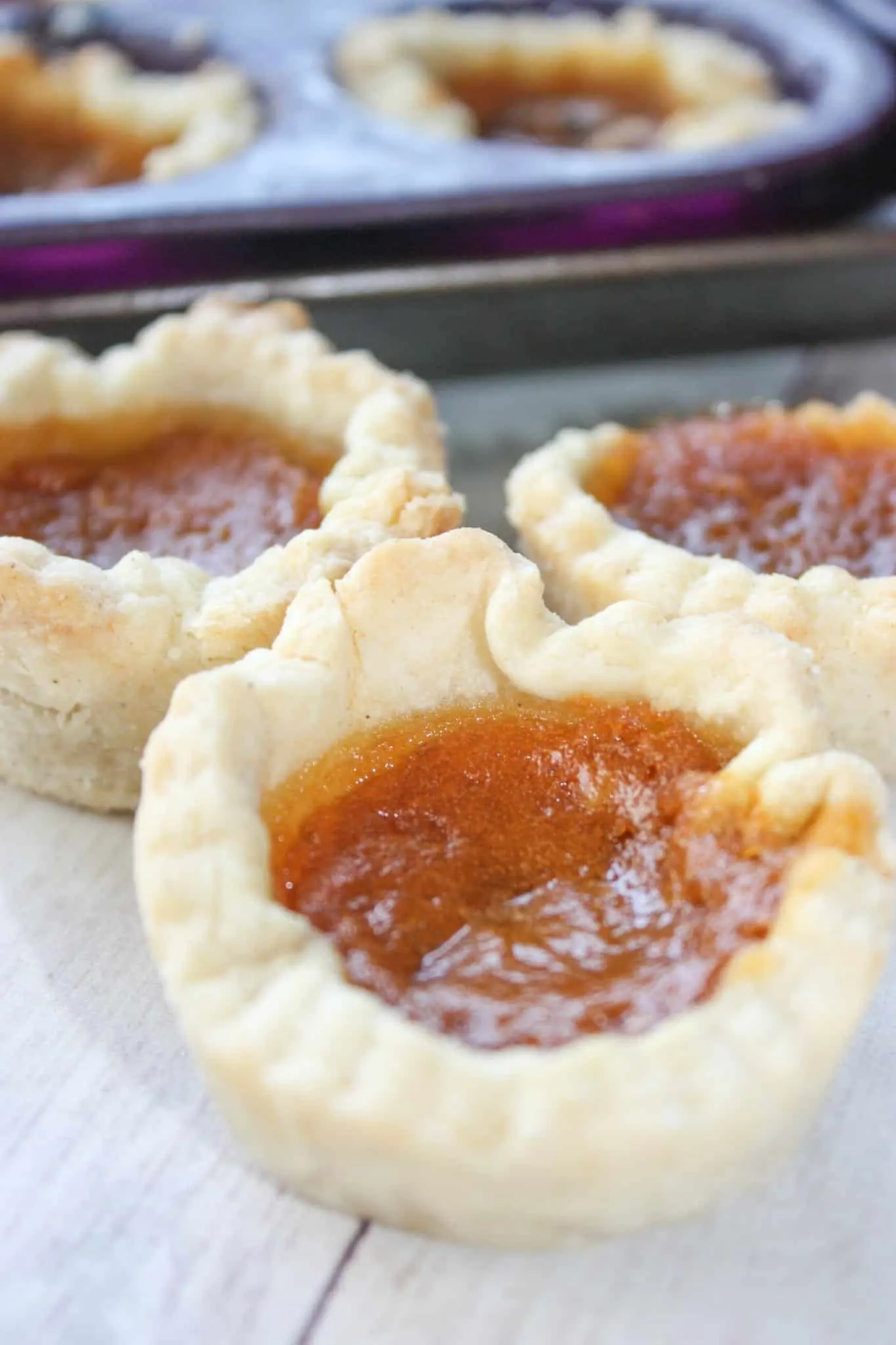 Pumpkin Butter Tarts are a seasonal twist on traditonal butter tarts.  These gluten free tarts will be a tasty addition to any fall menu.