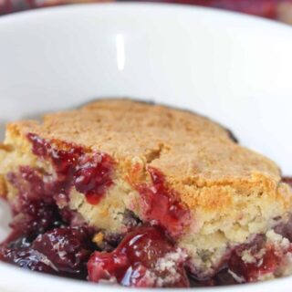 Jumbleberry Pudding is a delicious blend of seasonal fruits crowned with a cake like topping.  This gluten free pudding cake uses frozen berries and can be a fruity finish to a meal any time of the year.