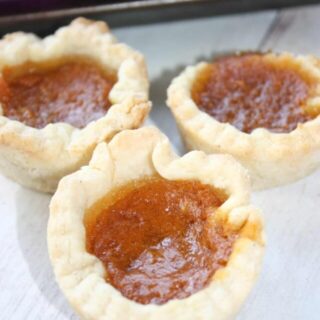 Pumpkin Butter Tarts are a seasonal twist on traditonal butter tarts.  These gluten free tarts will be a tasty addition to any fall menu.