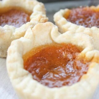 Pumpkin Butter Tarts are a seasonal twist on traditonal butter tarts.  These gluten free tarts will be a tasty addition to any fall menu.