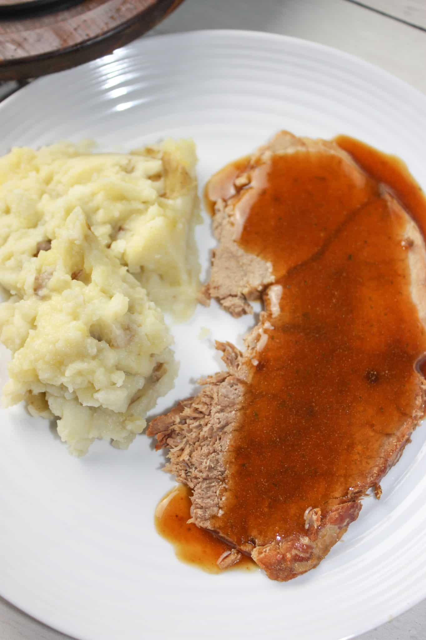Instant Pot Beef Round Roast with Gravy takes a tougher cut of beef and turns it into a moist and tender main course.  This pressure cooker recipe makes it easy to serve up Sunday Dinner any day of the week!