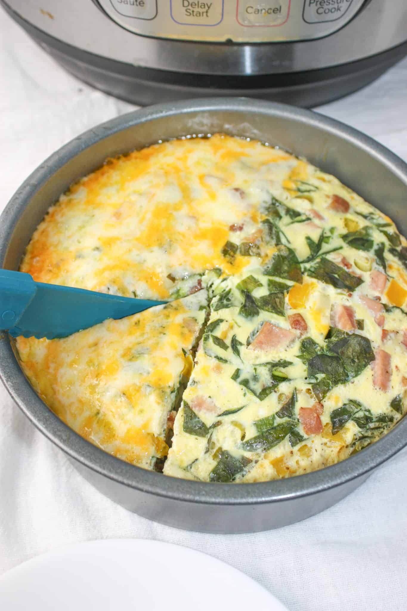 Instant Pot Crustless Quiche is a delicious breakfast or brunch option.  This pressure cooker recipe is loaded with ingredients and can easily be modified to suit your own tastes.