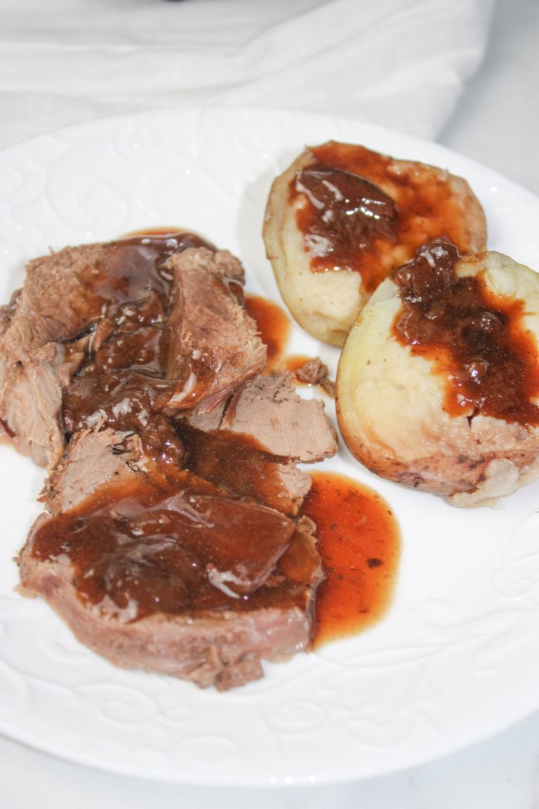 Instant Pot Venison Rump Roast, Potatoes and Cherry Gravy is a delicious pressure cooker recipe.  Enjoy this tender roast and baked potatoes smothered in a thick, tasty gravy loaded with bing cherries.