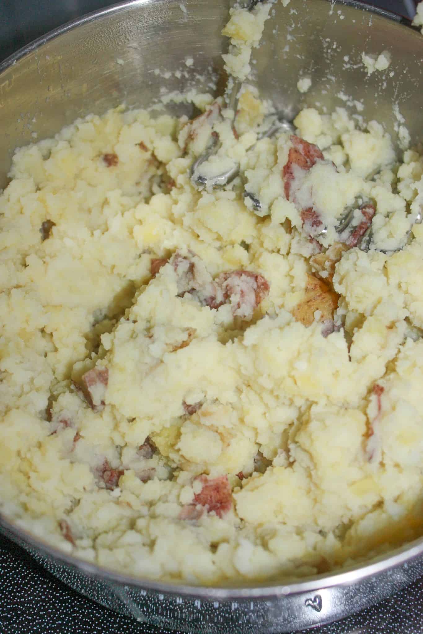 Mashed potatoes are a staple side dish in many of our homes.  Lazy Mashed Potatoes is a quick and easy recipe that skips the peeling and boiling steps. 