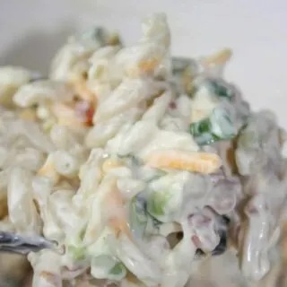Million Dollar Pasta Salad takes a popular dip recipe and turns it into a delicious, gluten free pasta salad. &nbsp;