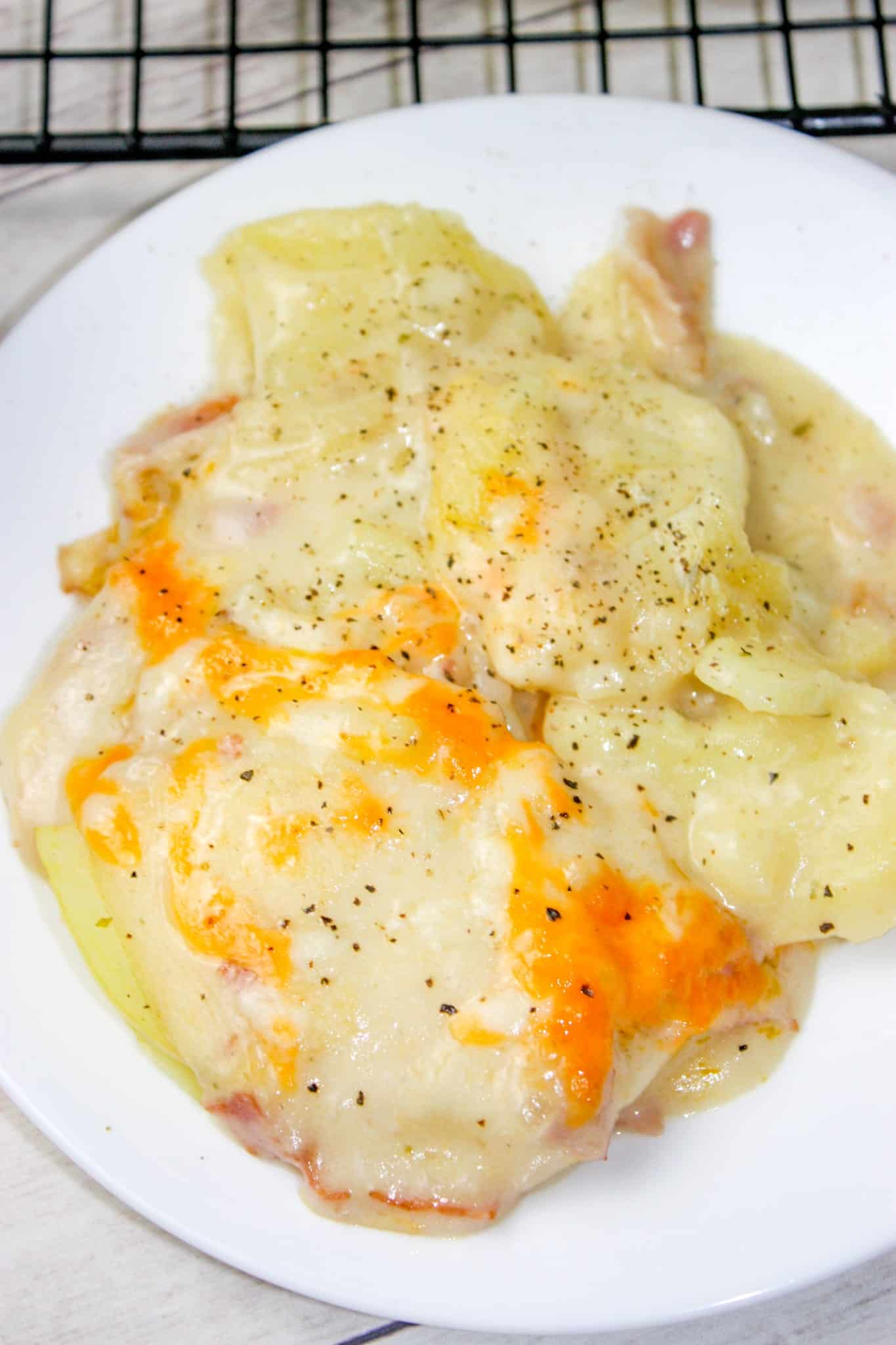 Cooking Scalloped Potatoes in the Instant Pot is a real time saver for this comfort food casserole.  Instant Pot Cheesy Bacon Scalloped Potatoes can be cooked quickly and added as a side dish any day of the week.