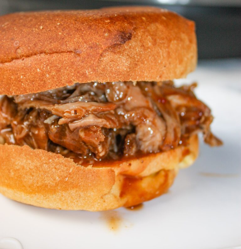 Instant Pot Pulled Pork is a delicious gluten free pulled pork recipe.  The Instant Pot allows you to take a pork shoulder roast and turn it into a shredded masterpiece in less time than a slow cooker.
