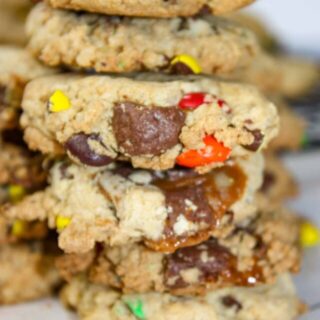 Candy cookies are a nice crunchy cookie base loaded with oatmeal, M & M candies and chewy Turtles chocolates.  This gluten free dessert, or snack, is sure to be a hit in your home.