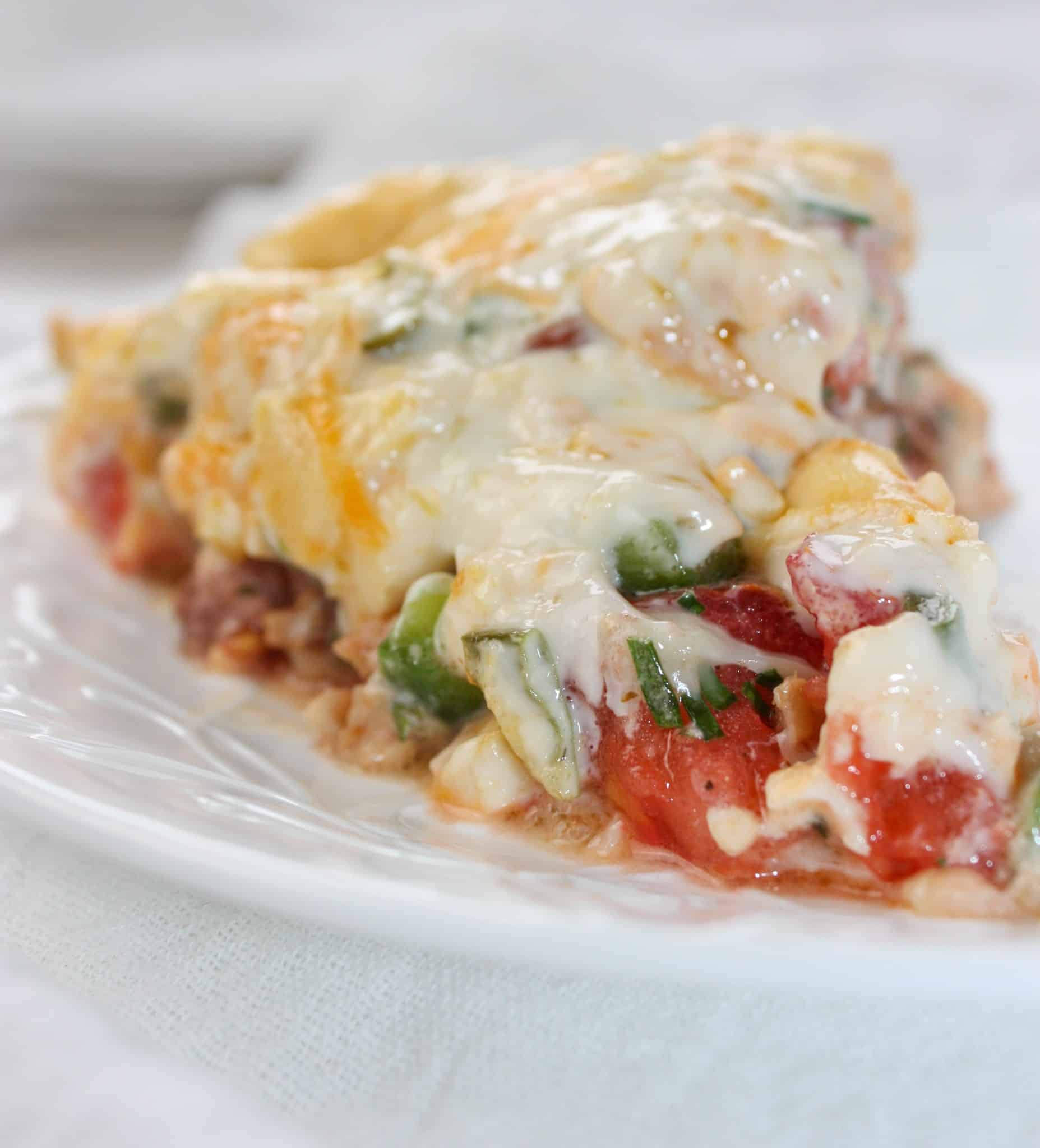 Tomato Pie is a versatile and tasty recipe that can easily be made gluten free with your choice of pie crust.  This cheesy, tomato dish can stand alone or complement any main course.