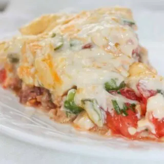 Tomato Pie is a versatile and tasty recipe that can easily be made gluten free with your choice of pie crust.  This cheesy, tomato dish can stand alone or complement any main course.