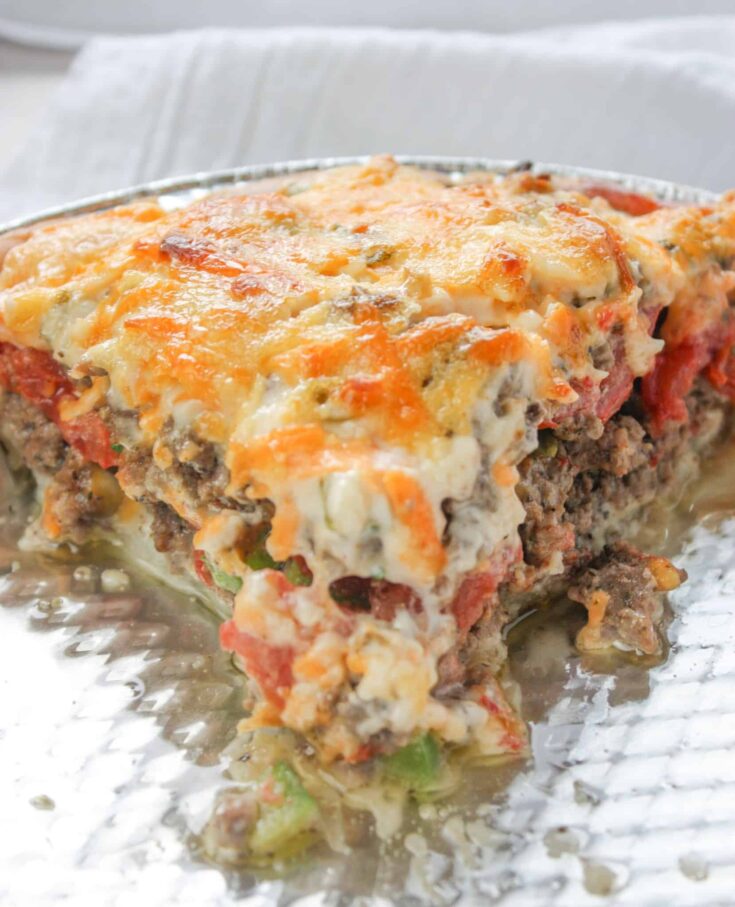 Beef and Tomato Pie is a delicious dinner recipe filled with ground beef, cheese, tomatoes and spices.