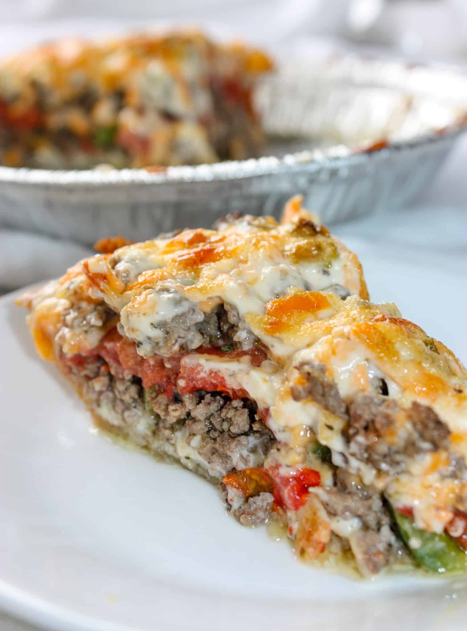 Beef and Tomato Pie is a delicious dinner recipe filled with ground beef, cheese, tomatoes and spices.