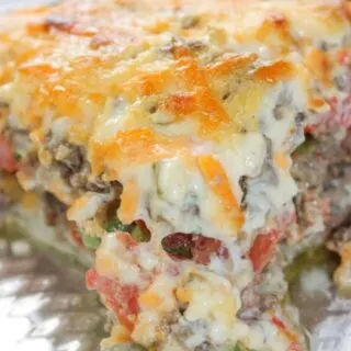 Beef and Tomato Pie is a delicious dinner recipe filled with ground beef, cheese, tomatoes and spices.