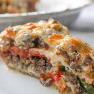 Beef and Tomato Pie is a delicious dinner recipe filled with ground beef, cheese, tomatoes and spices.