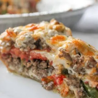 Beef and Tomato Pie is a delicious dinner recipe filled with ground beef, cheese, tomatoes and spices.