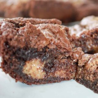 A popular flavour combination that I also enjoy is the blend of peanut butter and chocolate.  These gluten free Peanut Butter Brownies make a great addition to a dessert tray any time of the year!