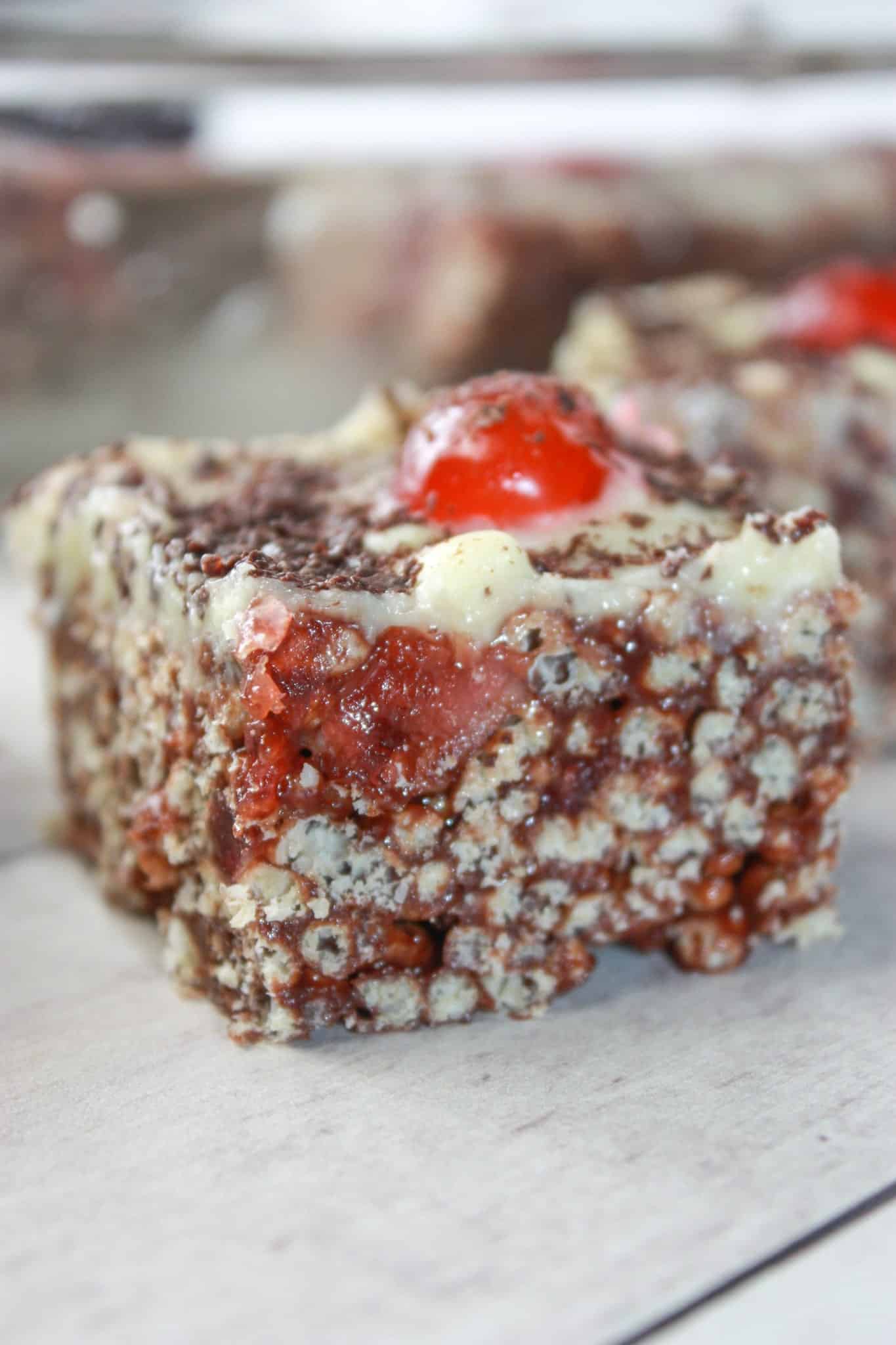 Black Forest Crispy Rice Squares are an easy no bake dessert recipe.  This dressed up version of Rice Krispie Squares is loaded with chocolate and cherries that make it pleasing to the eye as well as the taste buds.