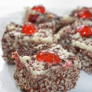 Black Forest Crispy Rice Squares are an easy no bake dessert recipe.  This dressed up version of Rice Krispie Squares is loaded with chocolate and cherries that make it pleasing to the eye as well as the taste buds.