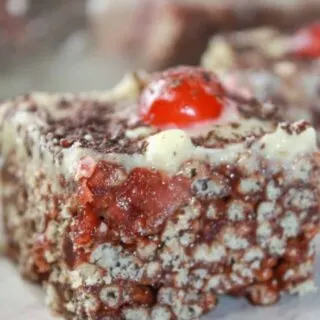Black Forest Crispy Rice Squares are an easy no bake dessert recipe.  This dressed up version of Rice Krispie Squares is loaded with chocolate and cherries that make it pleasing to the eye as well as the taste buds.