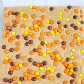 Peanut Butter Fudge is a creamy, decadent treat that will quickly be devoured.  This easy recipe does not require a candy thermometer and can be made in minutes.