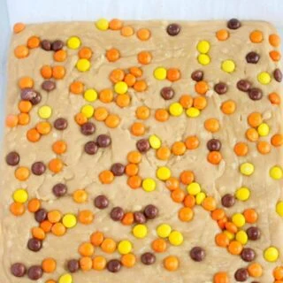 Peanut Butter Fudge is a creamy, decadent treat that will quickly be devoured. &nbsp;This easy recipe does not require a candy thermometer and can be made in minutes.