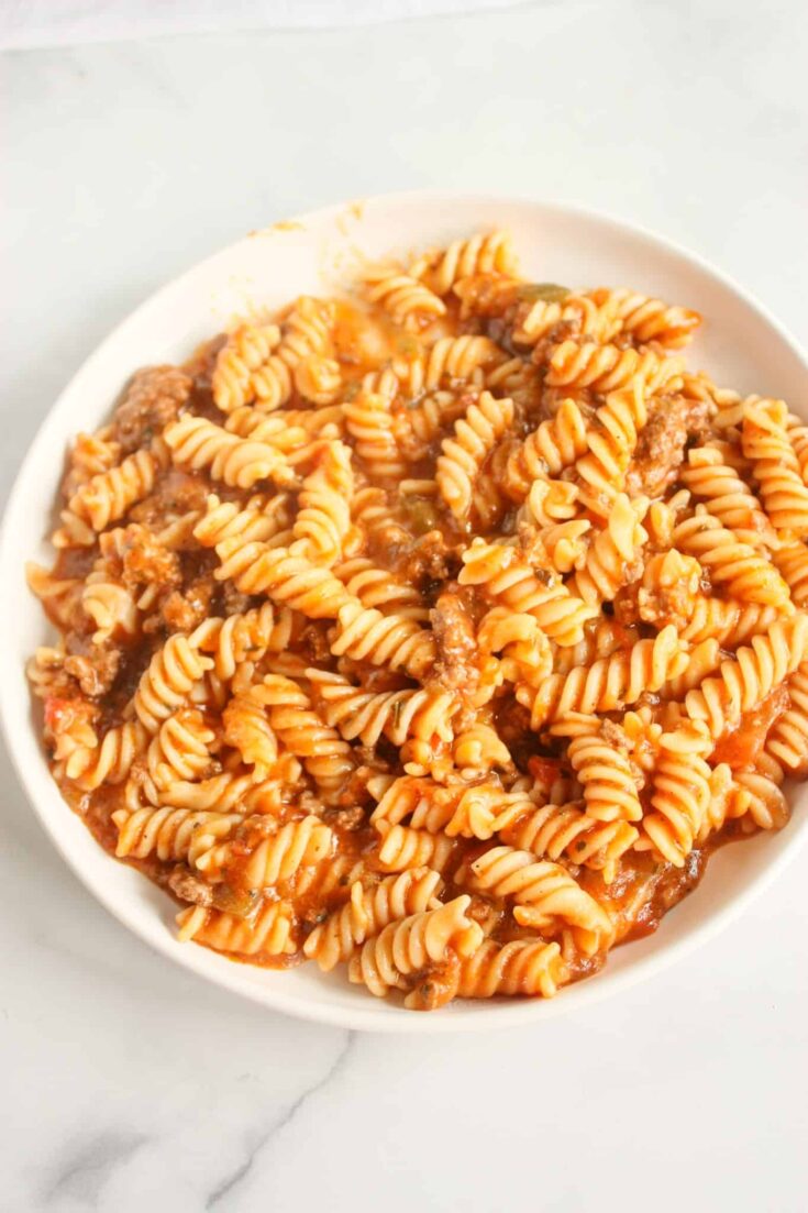 Instant Pot Salsa Verde Pasta is a simple pressure cooker recipe that can be prepared in under 30 minutes. This gluten free recipe gets a bit of a kick from the Salsa Verde.