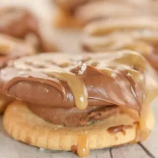 Dipped Rolo Stuffed Crackers are a more decadent version of the traditional Ritz stuffed cracker.  This gluten free version is a very tasty treat any time of the year, but it is a quick and easy recipe for Christmas dessert trays!  