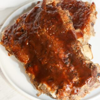 Instant Pot Ribs is a decadent fall off the bone dinner recipe.  Rubbed with spices and smothered in sauce, these gluten free pork ribs are sure to please the palate.