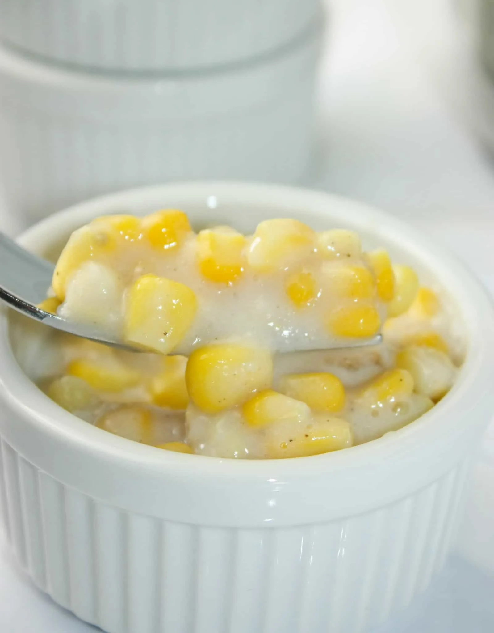 Gluten Free Creamed Corn is a quick side dish that can easily be whipped up on a busy week night.  This dairy free version uses gluten free flour as a thickener.