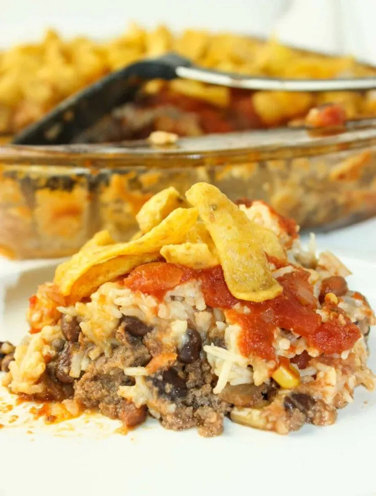 Another tasty variation of Hobo Casserole, is a spice upped version called Hobo Casserole Mexican Style. Loaded with ground beef, beans, rice, cheese and salsa it is a complete meal in one pan!