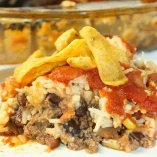 Another tasty variation of Hobo Casserole, is a spice upped version called Hobo Casserole Mexican Style. Loaded with ground beef, beans, rice, cheese and salsa it is a complete meal in one pan!