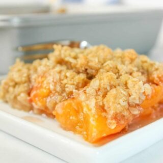 Gluten Free Peach Crisp is a tasty and very easy dessert recipe.  This seasonal fruit is in abundance right now and whipping up a delicious crisp is a great way to use up some ripe peaches.