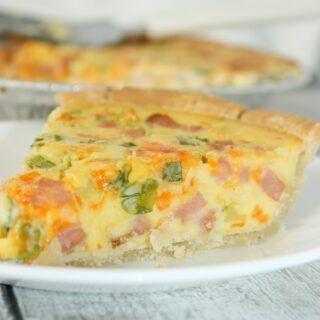 If you are looking for an easy quiche recipe, for your next brunch or light dinner, this is the perfect recipe for you!  This tasty Ham and Cheese Quiche is easy to make gluten free with your choice of pie shell.