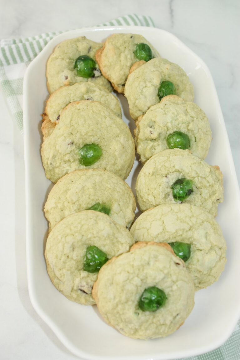 Mint Chocolate Chip Cookies are a tasty variation to traditional chocolate chip cookies.  Add some green colouring, mint chips and green cherries to give these cookies a festive flair for St. Patrick's Day or for your Holiday dessert trays!