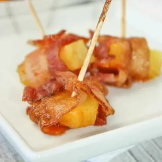 Bacon Wrapped Pineapple is an easy appetizer recipe.  Use a few staple items to create a flavourful sauce and use some gluten free bacon.