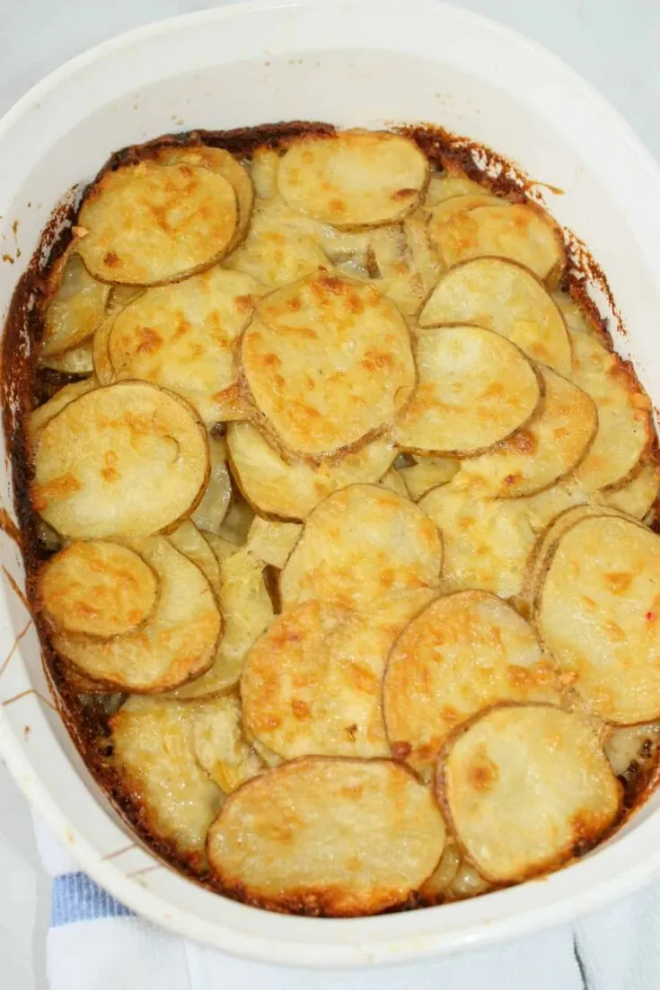 Gluten Free Au Gratin Potatoes is a cheesy comfort food casserole.   This potatoes casserole can be added as a side dish any day of the week.