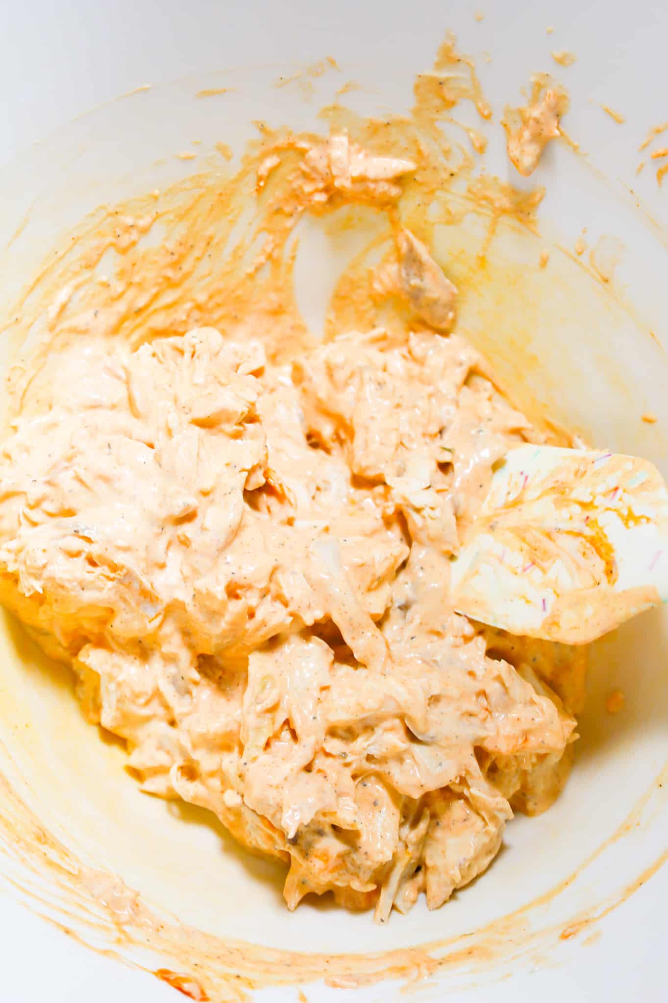 shredded chicken, mayo, ranch dressing and Buffalo sauce all stirred together in a mixing bowl