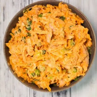 Buffalo Chicken Salad is a delicious recipe using rotisserie chicken, chopped green onions and shredded cheddar cheese all tossed in mayo, Buffalo sauce and ranch dressing.